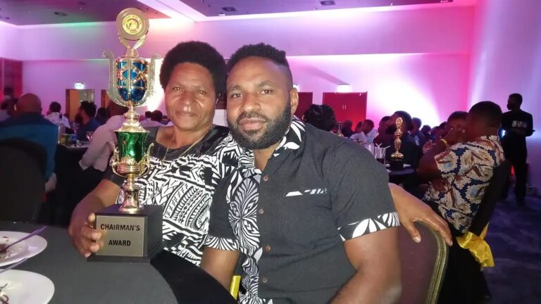 Yunny Patrick and his mother with the chairman’s choice award in 2019.