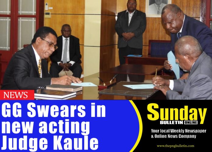 Justice Kaule signing his contract before H.E. Grand Chief Sir Bob Bofeng Dadae at Government House. Picture supplied by Government House Media Team. Justice Kaule signing his contract before H.E. Grand Chief Sir Bob Bofeng Dadae at Government House. Picture supplied by Government House Media Team.