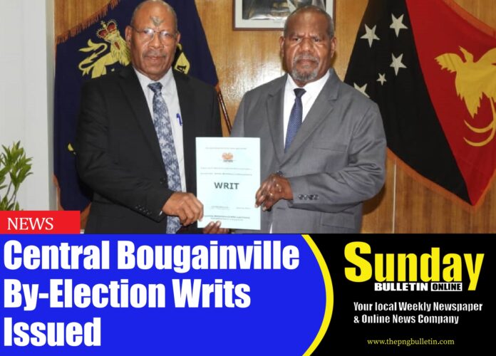 Deputy Electoral Commissioner John Kalamoroh presenting the Writs to the Governor General Chief Sir Bob Dadae. Picture supplied by Government House Team. Deputy Electoral Commissioner John Kalamoroh presenting the Writs to the Governor General Chief Sir Bob Dadae. Picture supplied by Government House Team.