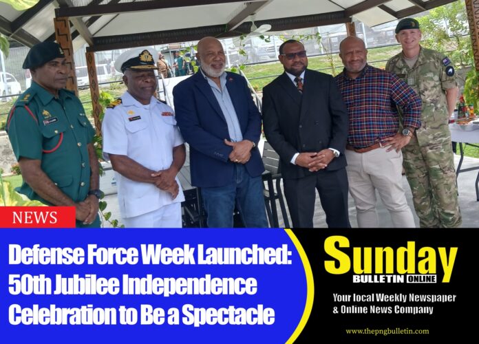 Caption: Dr. Billy Joseph posing for a shot with PNG DF Officers