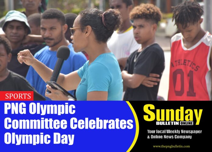 Dika Toa addressing the children at Ela Beach. Photo by GABRIEL KATUHO.