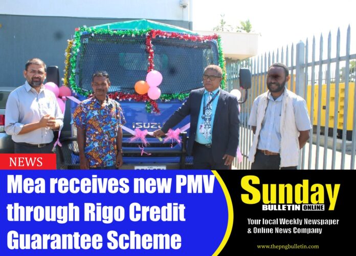 The Second Secretary to the Office of the Member for Rigo presents the vehicle to Mr. Guina Mea outside the Mama Bank office in Port Moresby. Standing beside them are representatives from Mama Bank. Picture by GEORGINA MICHAEL.