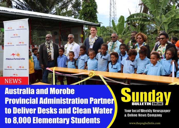 Peter To Rot Elementary School students and staff with dignitaries following the official handover of the desks and rainwater tanks to the school. Pictures by Australian High Commission Port Moresby.