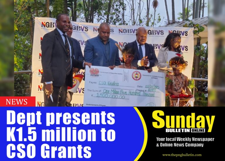 Minister for Community Development, Youth and Religion Hon. Jason Peter presenting the K1.5 million cheque to the Civil Society Organization Grant. Photo by Dalcy Lulua