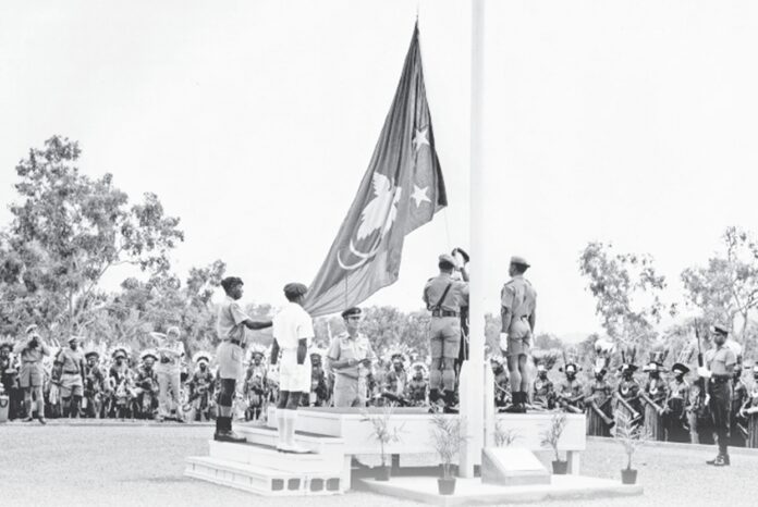 PNG's flag being raised on Independence Hill, 1975. Picture supplied.
