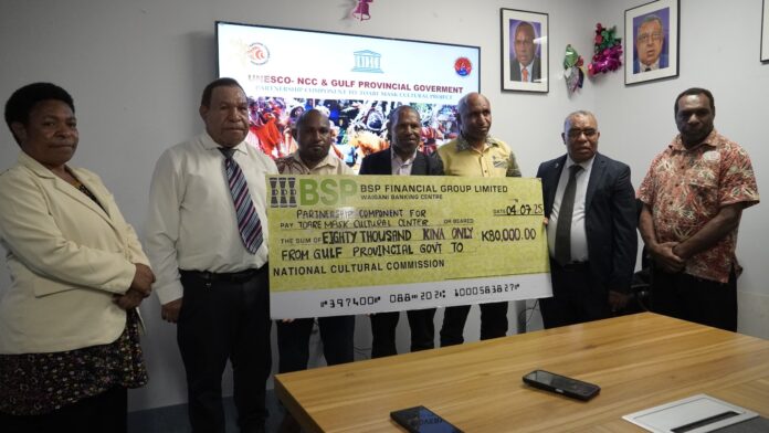 (Second from left) Gulf Provincial Administrator Clement Tare presents an official K80,000 cheque to NCC Executive Director Steven Enomb Kilanda (second right), witnessed by TAC First Secretary David Lepi and officers in Port Moresby. Picture supplied by NCC.