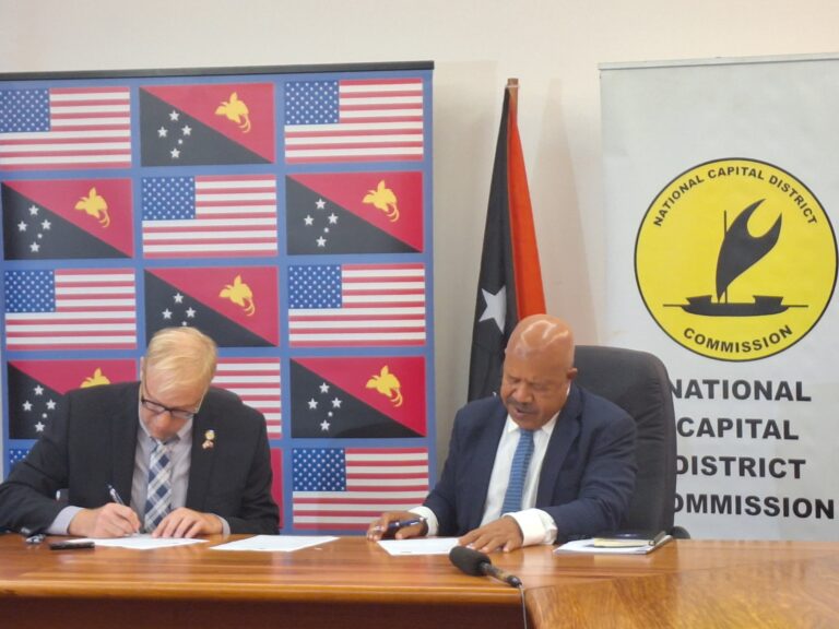 From left to right: Mr Jeff Williams - Director of Community Engagement in the Office of the Mayor of Long Beach and Governor for NCD Powes Parkop signing the MoU of Sister city between NCD and Long Beach. Pic by DALCY LULUA