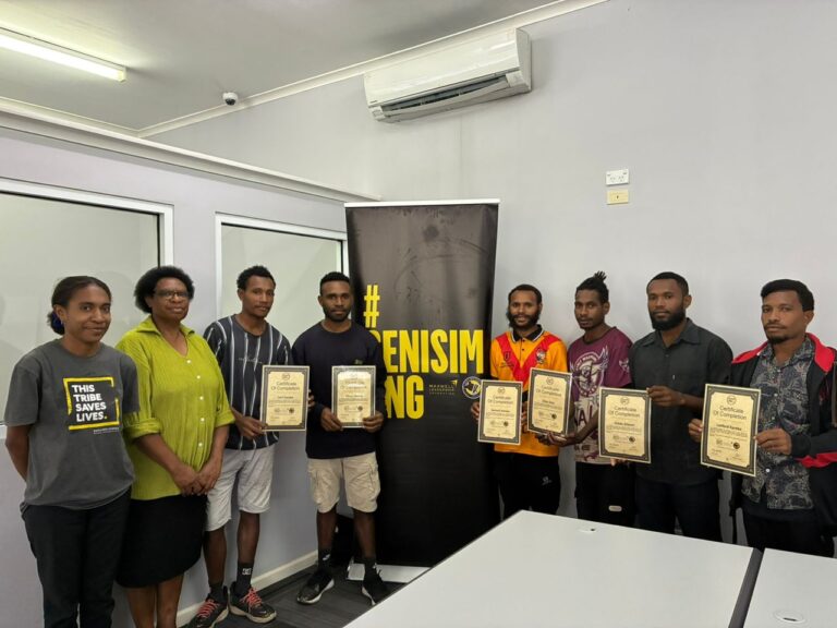 Youths receiving certificates from Senisim PNG Coordinator for Port Moresby Agnes Andrias at PNG Tribal Foundation office in Port Moresby yesterday. Picture supplied.