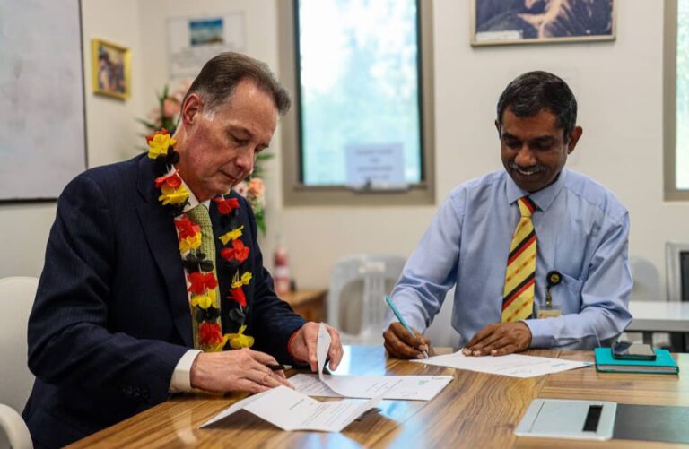 From left, BSP Group general manager, people and culture, Johnathan Harvey and IBSU Vice Chancellor Professor Ramachandran Arunachalam sign the MoU. Picture supplied.
